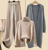 Aprikosenfarbener Pullover Aprikosenfarbene Hose und grauer Blazer